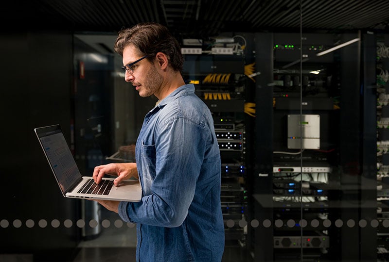 man working in a server room