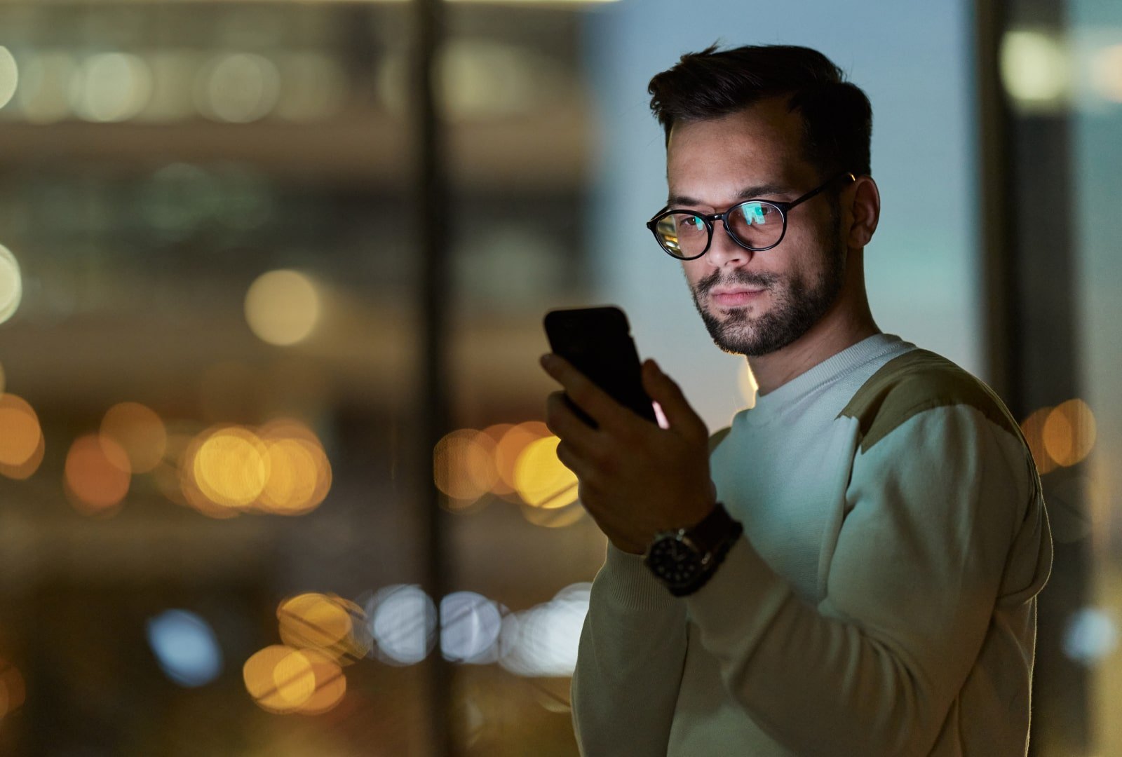 man looking at his smartphone