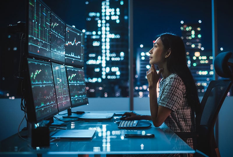 Woman looking at a monitor bank