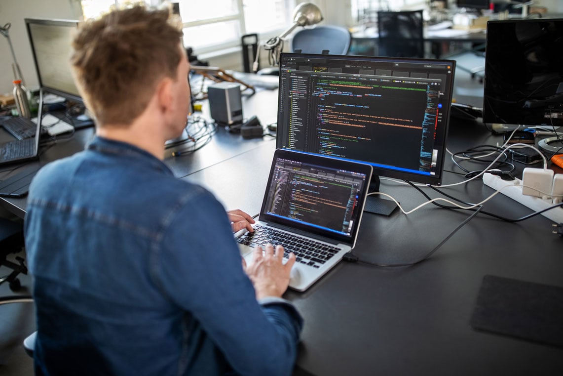 man looking at code