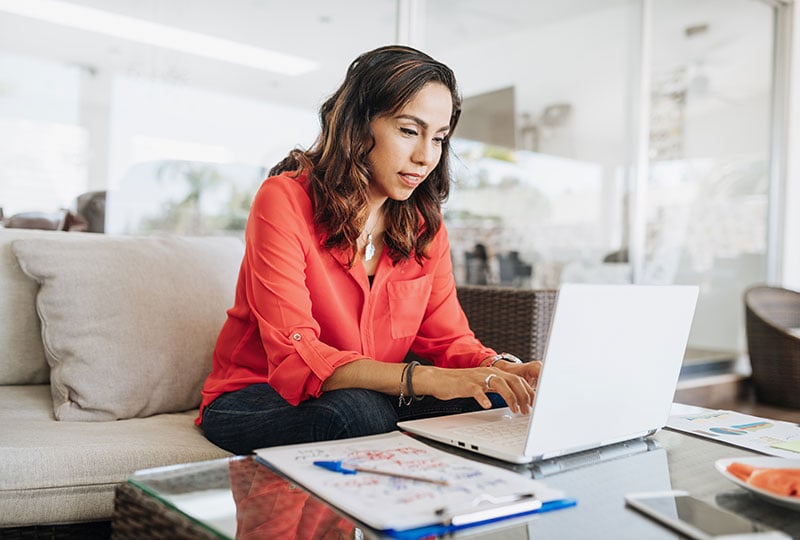 woman typing on laptop