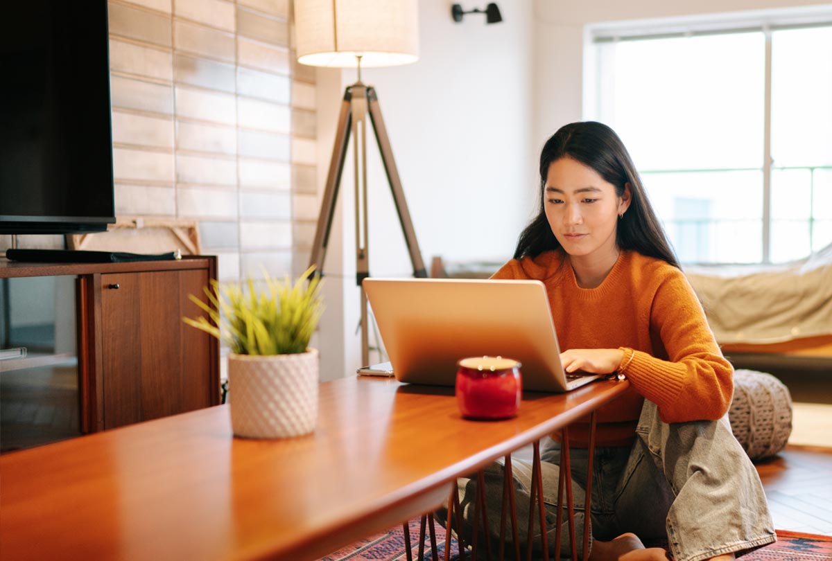 woman working on her laptop at home