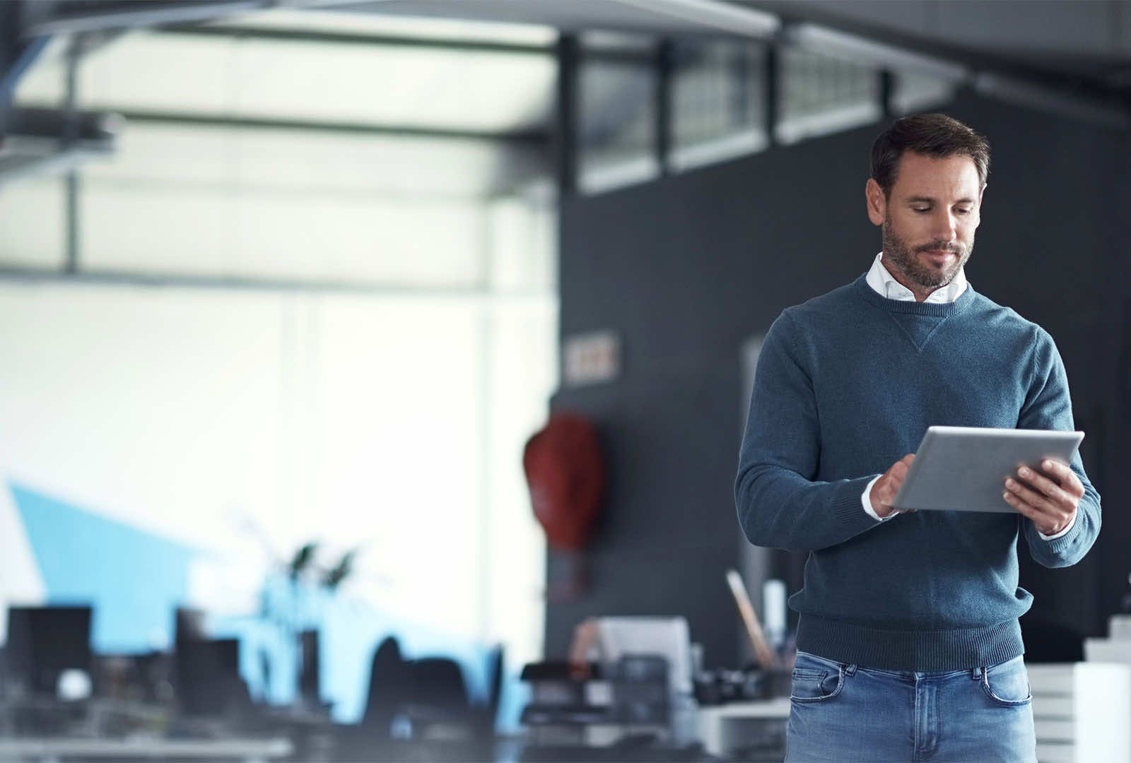 man looking at a tablet