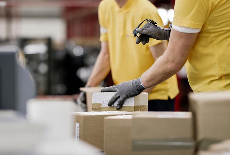man scanning a box