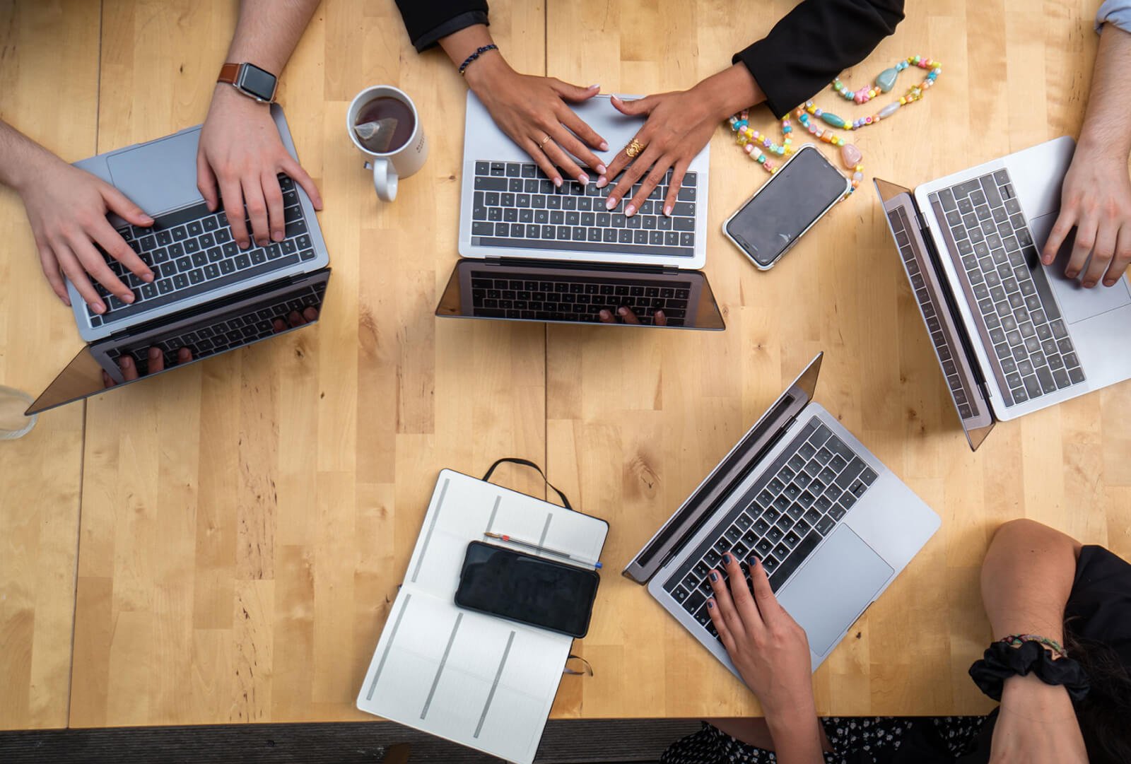 group of coworkers working on their laptops