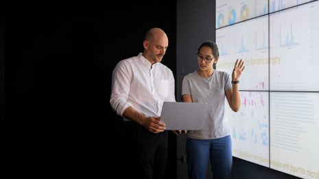 man and woman making a presentation