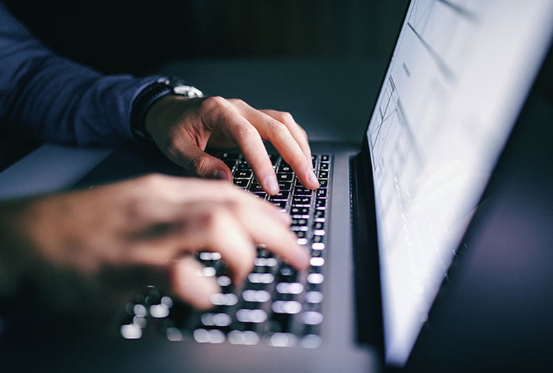 typing on a laptop