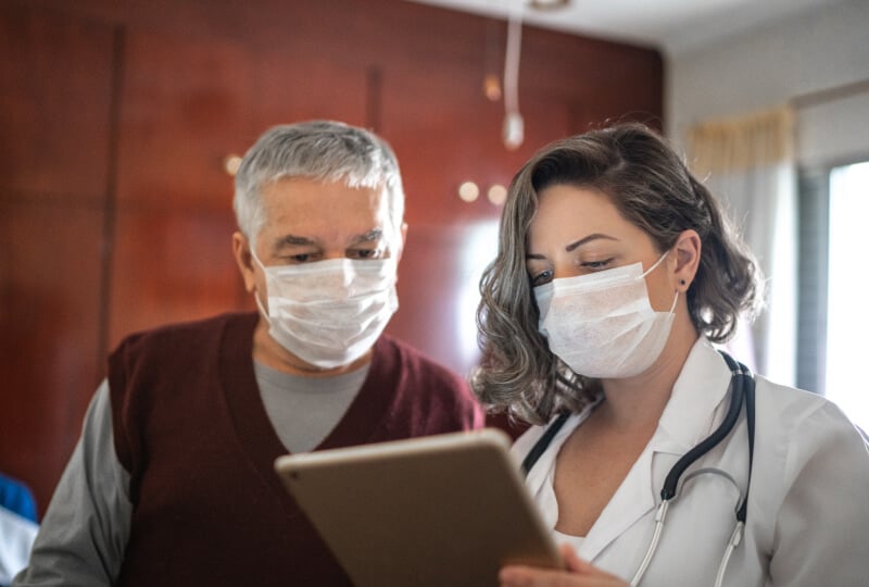 Doctor and patient looking at a tablet