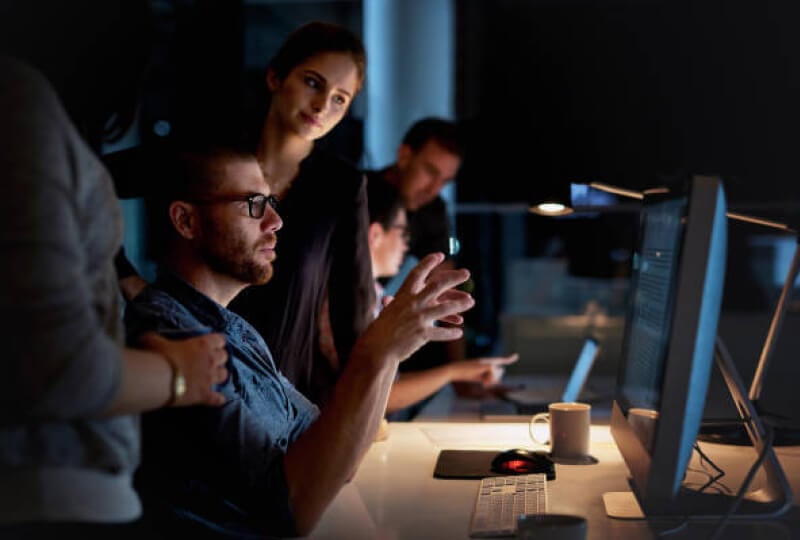 people looking at a computer