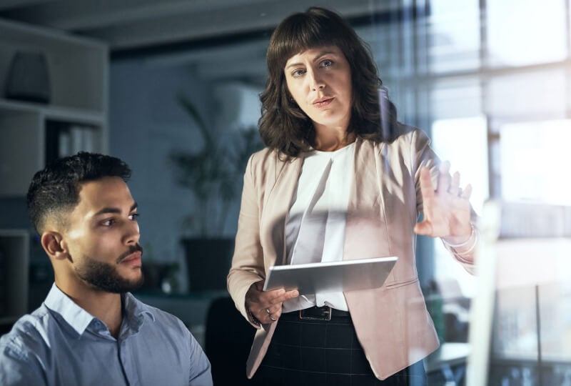 two coworkers discussing something