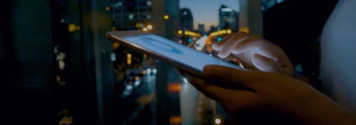 hand interacting with a tablet
