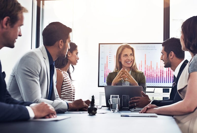 coworkers sitting at a conference table