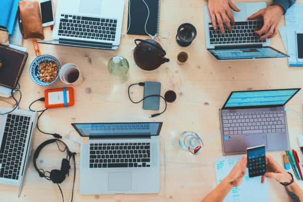 birds-eye-view of desk with laptops