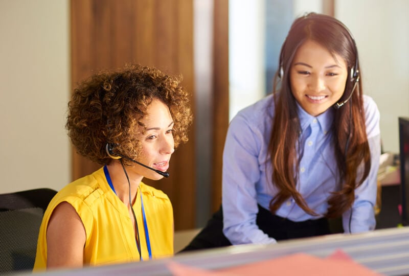 two women working at a work station