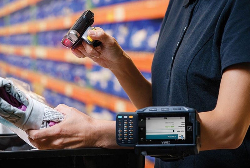 person scanning things in a warehouse