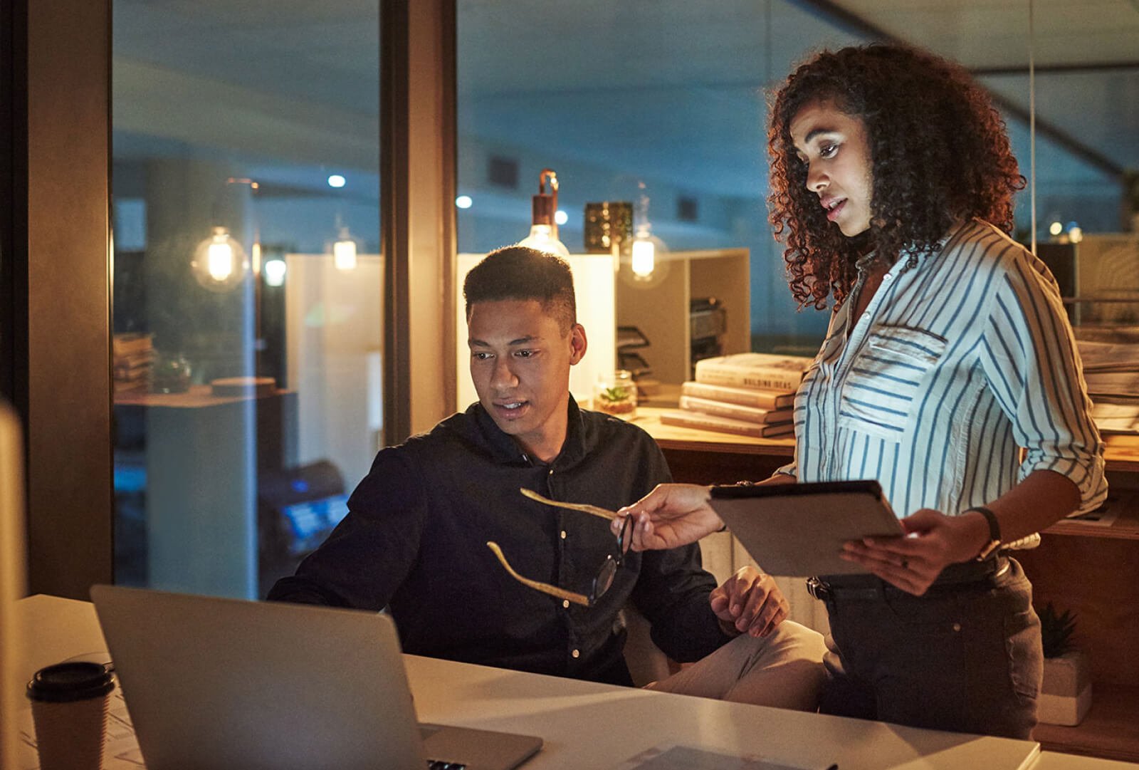 two people looking at a computer